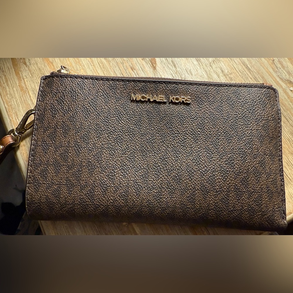 Michael Kors Jetset wristlet. Some lipgloss stains on interior zipper pocket